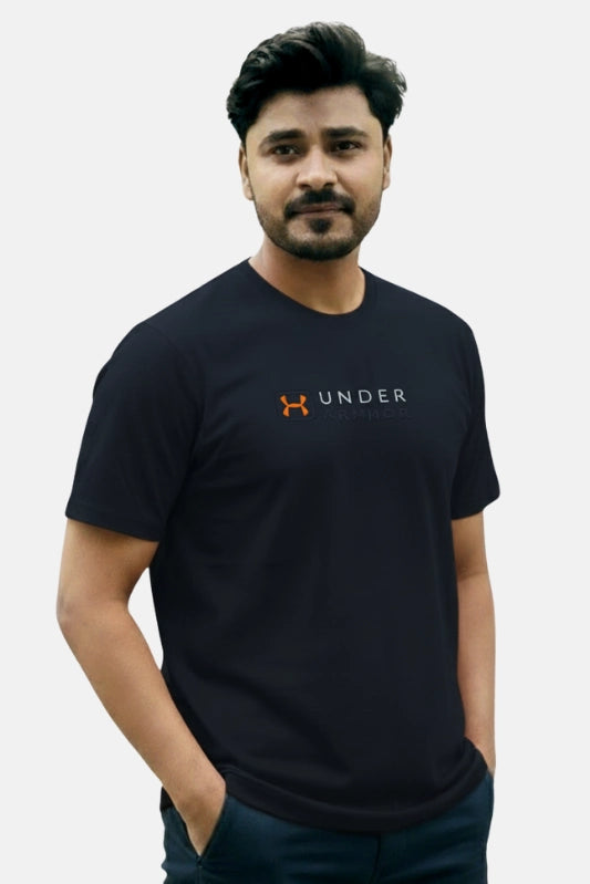 Man wearing a black Under Armour t-shirt against a plain background Navy Blue ‘Under Armour’ Tracksuit Royal Outfits Track Suits - Navy Blue ‘Under Armour’ Tracksuit - Royal Outfits - Track Suits