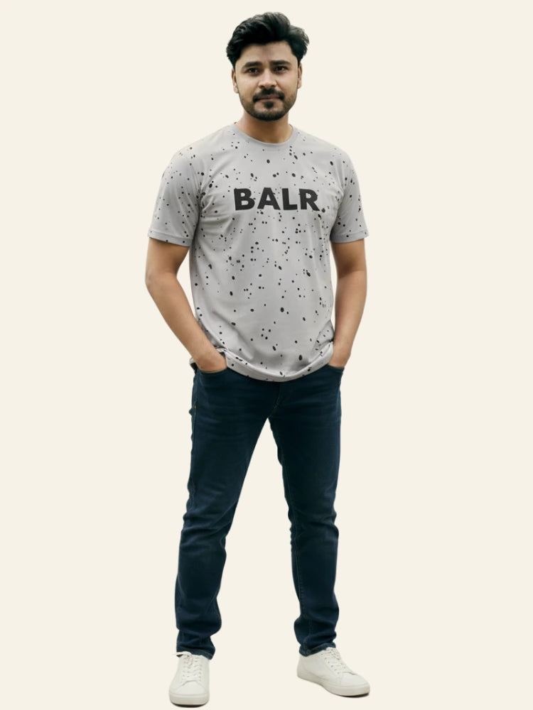 Man wearing a gray t-shirt with 'BALR.' logo and dark jeans on a white background Light Grey ‘BALR’ T-Shirt Royal Outfits Graphic T Shirts