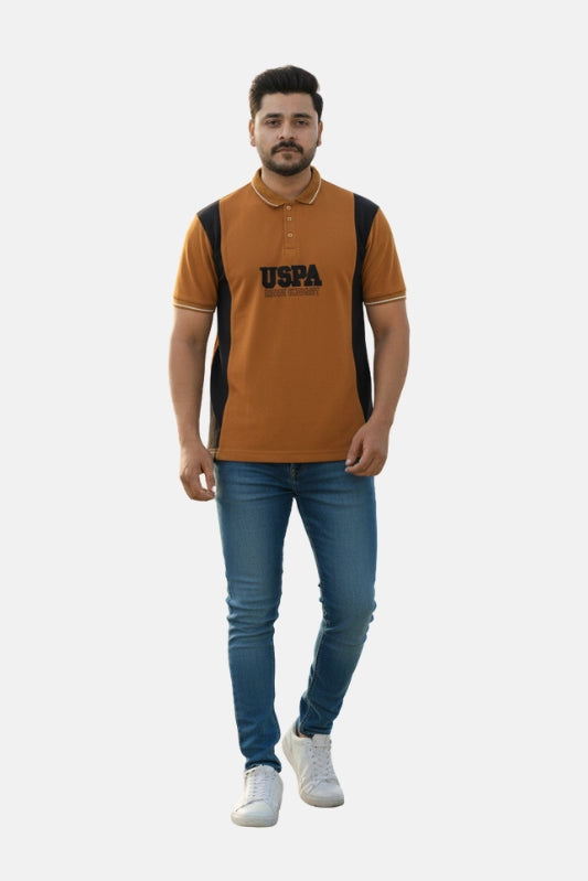 Man wearing a brown and black polo shirt with 'USPA' branding on a white background - Men’s USPA Brown Colour Contrast Panel Polo T-Shirt - Royal Outfits - POLO T Shirts - Men’s USPA Brown Colour Contrast Panel Polo T-Shirt - Royal Outfits