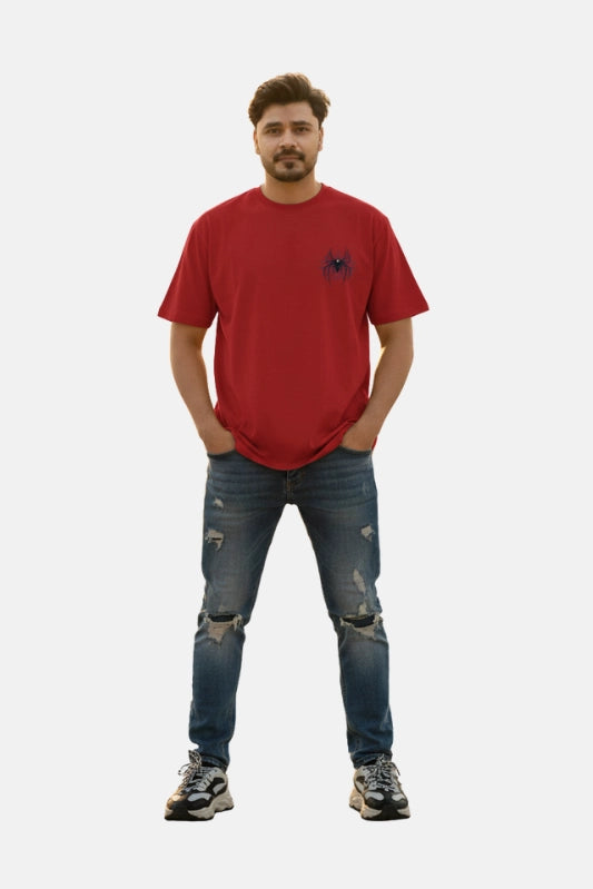 Man wearing a red t-shirt and blue jeans on a plain background Graphic Red Drop Shoulder Spider T-Shirt Royal Outfits Drop Shoulder T-Shirts - Graphic Red Drop Shoulder Spider T-Shirt - Royal Outfits - Drop Shoulder T-Shirts - Graphic Red Drop Shoulder Spider T-Shirt - Royal Outfits