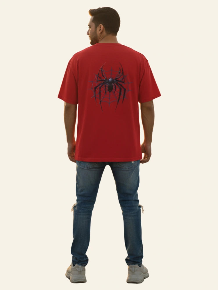 Man wearing a red t-shirt with a spider graphic on the back, standing against a plain background. Graphic Red Drop Shoulder Spider T-Shirt Royal Outfits Drop Shoulder T-Shirts