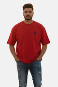Man wearing a red t-shirt with a small logo on a plain background Graphic Red Drop Shoulder Spider T-Shirt Royal Outfits Drop Shoulder T-Shirts - Graphic Red Drop Shoulder Spider T-Shirt - Royal Outfits - Drop Shoulder T-Shirts - Graphic Red Drop Shoulder Spider T-Shirt - Royal Outfits