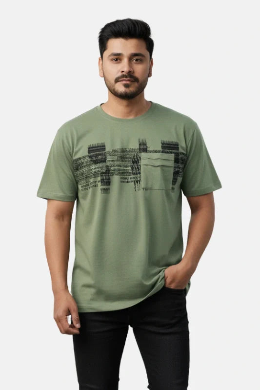 Man wearing a green t-shirt with black text design on a beige background - Graphic Light Green Print T-Shirt with Chest Pocket - Royal Outfits - Printed T Shirts - Graphic Light Green Print T-Shirt with Chest Pocket - Royal Outfits