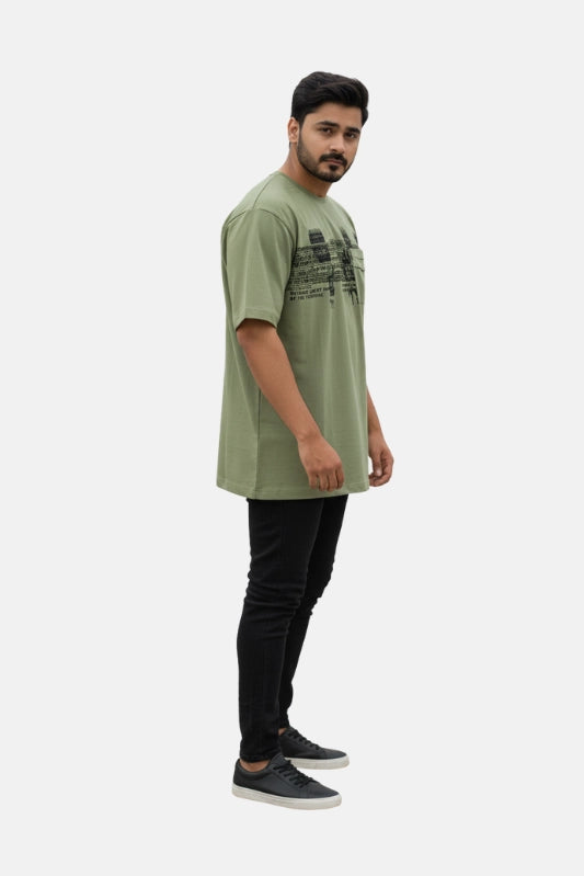 Man wearing a green t-shirt and black pants on a white background - Graphic Light Green Print T-Shirt with Chest Pocket - Royal Outfits - Printed T Shirts - Graphic Light Green Print T-Shirt with Chest Pocket - Royal Outfits