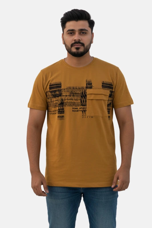Man wearing a mustard t-shirt with black text design on a beige background - Graphic Mustard Colour T-Shirt with Chest Pocket - Royal Outfits - Printed T Shirts - Graphic Mustard Colour T-Shirt with Chest Pocket - Royal Outfits