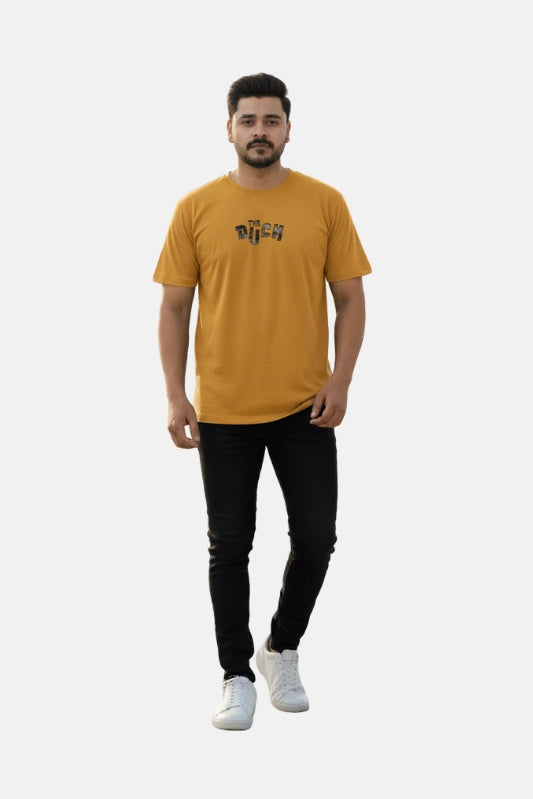 Man wearing a mustard yellow t-shirt with a logo on a white background - Graphic Mustard Drop Shoulder The Duck T-Shirt - Royal Outfits - Drop Shoulder T-Shirts - Graphic Mustard Drop Shoulder The Duck T-Shirt - Royal Outfits