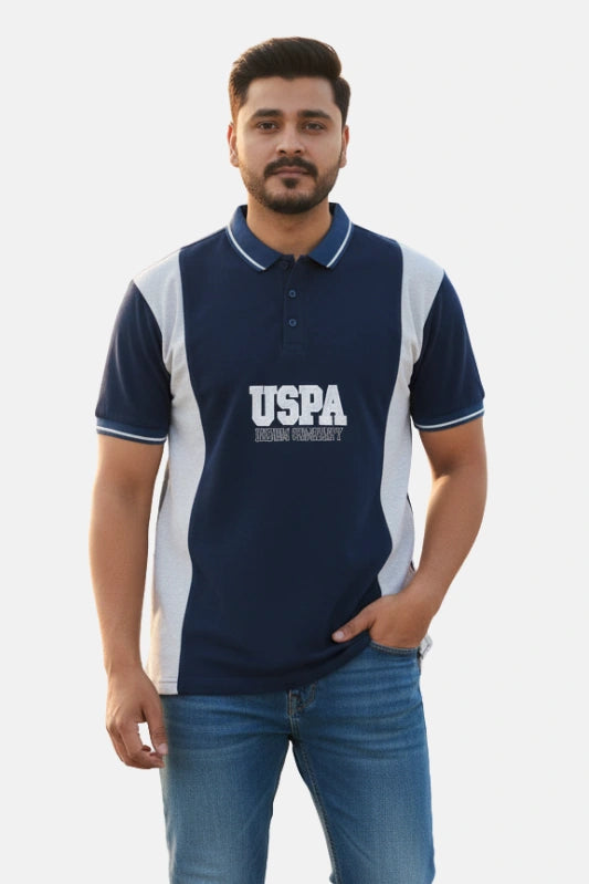 Man wearing a navy blue polo shirt with 'USPA' logo on a light background - Men’s Navy Blue USPA Contrast Panel Polo T-Shirt - Royal Outfits - POLO T Shirts - Men’s Navy Blue USPA Contrast Panel Polo T-Shirt - Royal Outfits
