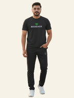 Man wearing a black 'Markhor' t-shirt and pants on a white background