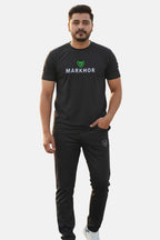 Man wearing a black 'Markhor' t-shirt and pants on a white background - Black 'Markhour' Tracksuit - Royal Outfits - Track Suits - Black 'Markhour' Tracksuit - Royal Outfits
