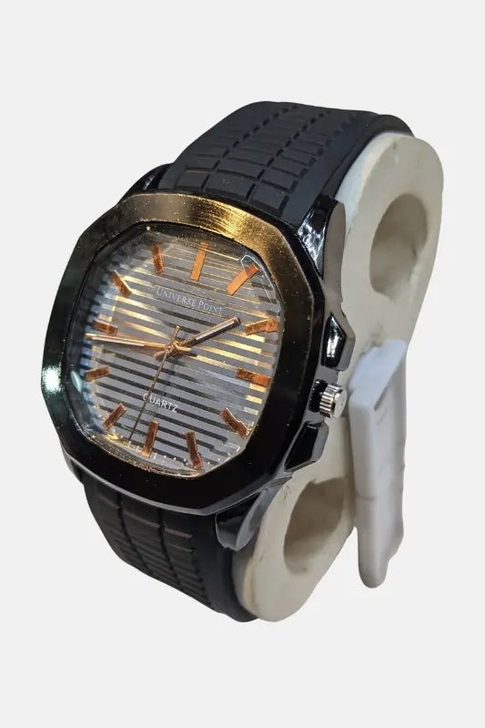 Wristwatch with black strap and gold accents on a white background