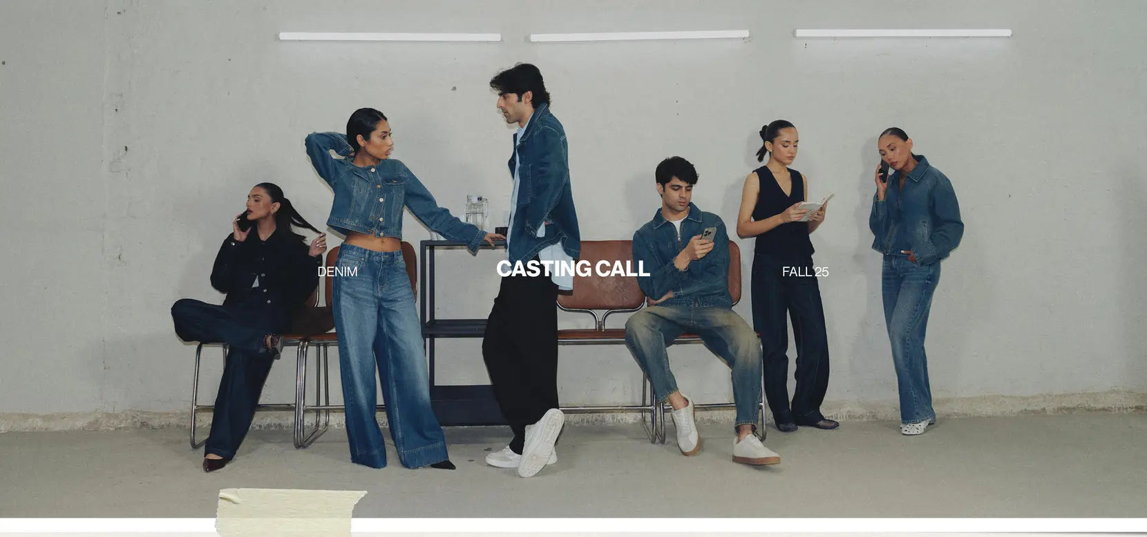 People sitting on benches (Boys and Girls) with a 'Casting Call' sign in the background